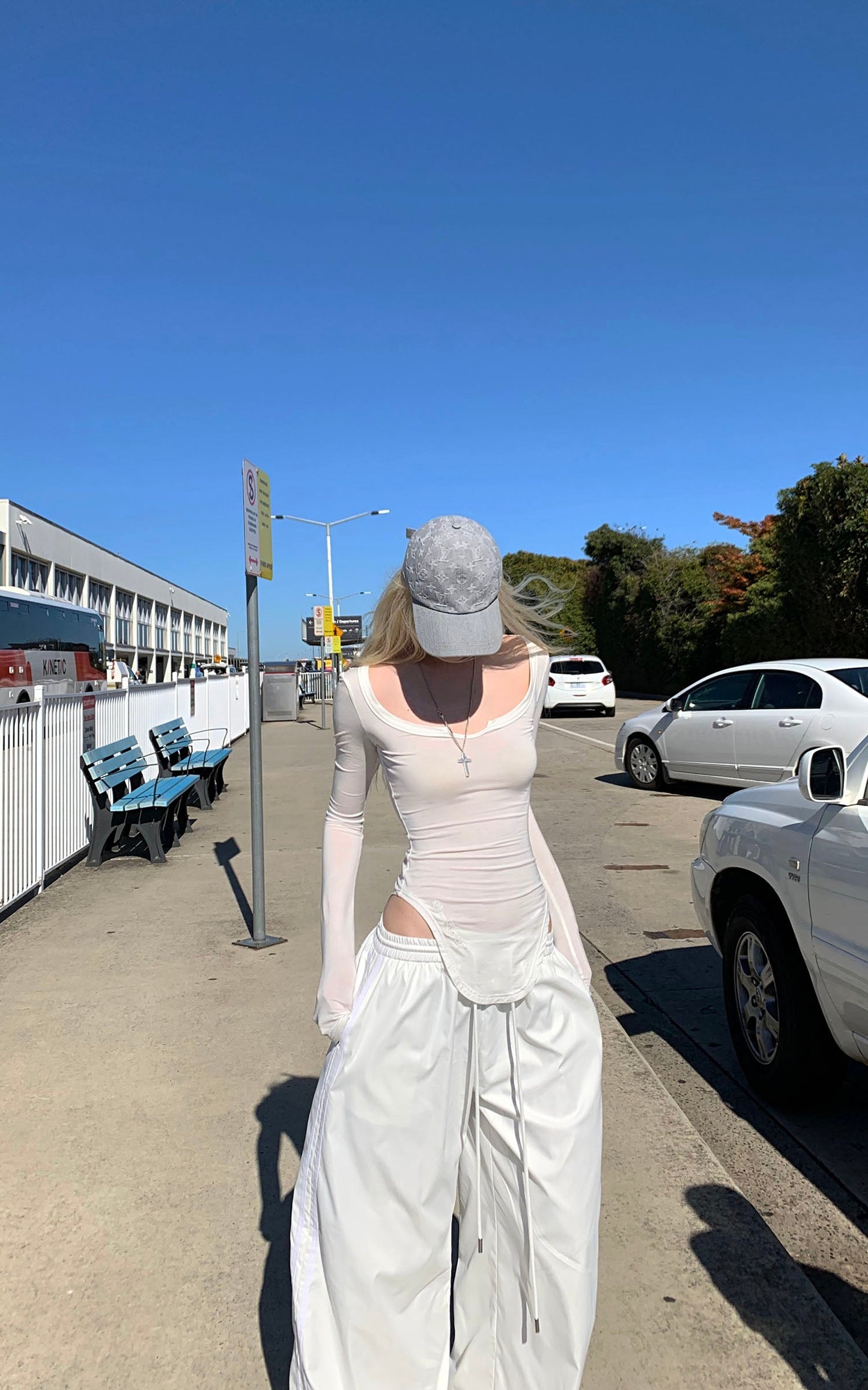 Cutout Neckline Curved Hem Long Sleeve Top